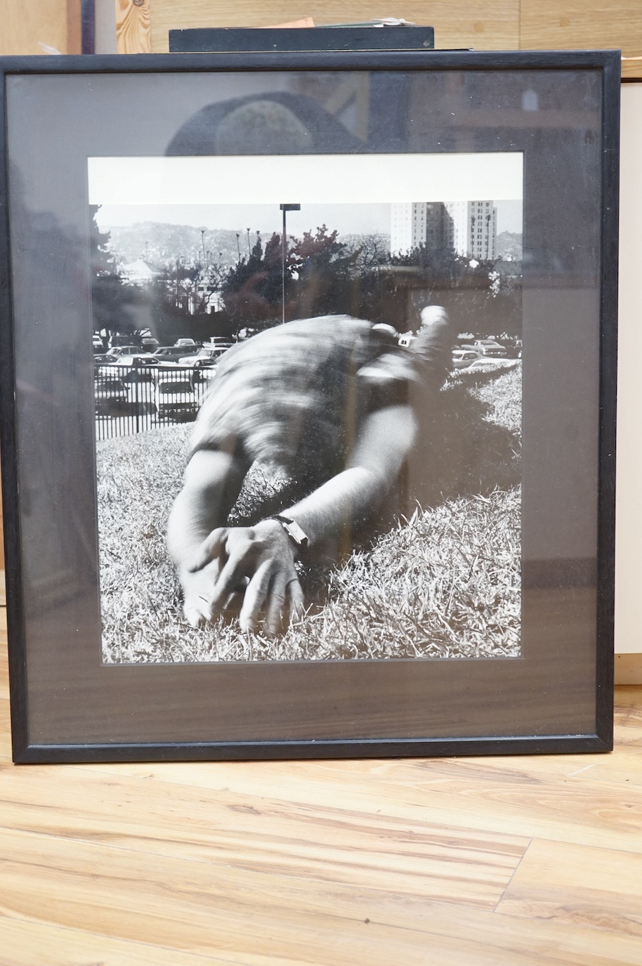 Hope Sandrow, photograph, man rolling on lawn, with typed Gracie Mansion Gallery label to the rear, reading; Gracie Mansion Gallery, 167 Avenue A, New York City, New York, 10009, HOPE SANDROW, Untitled, Silverprint 1983,